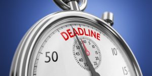 Imagem de um cronômetro e seus ponteiros apontando para a palavra "Deadline".
