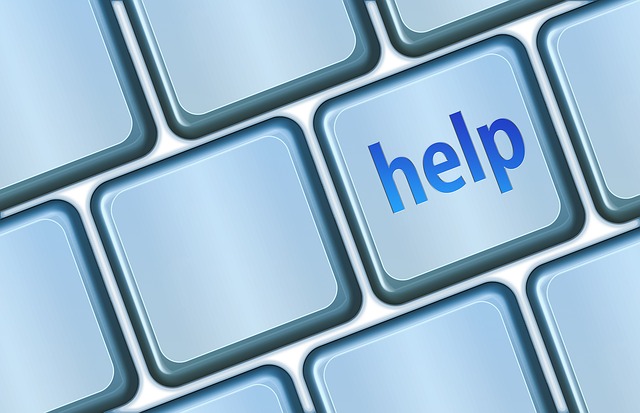 Tecla de computador Help. Help desk na nuvem.