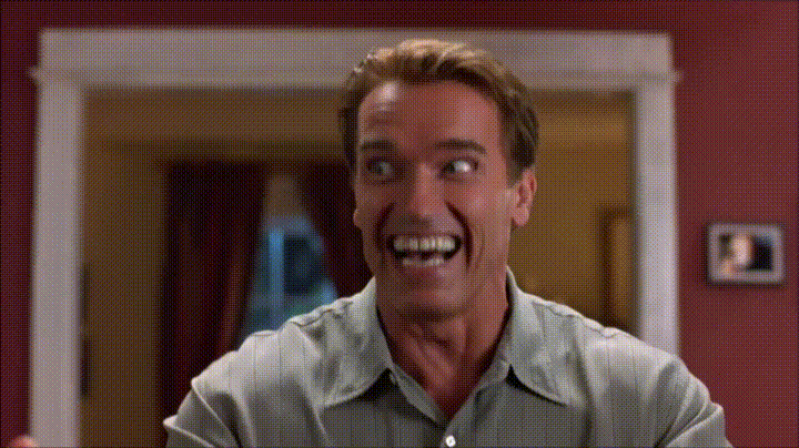 Gif Arnold Schwarzenegger rindo. Técnicas para lidar com o estresse no atendimento ao cliente.
